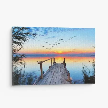 Leinwandbild steg bei sonnenuntergang über ruhigem see – Wallnifity®