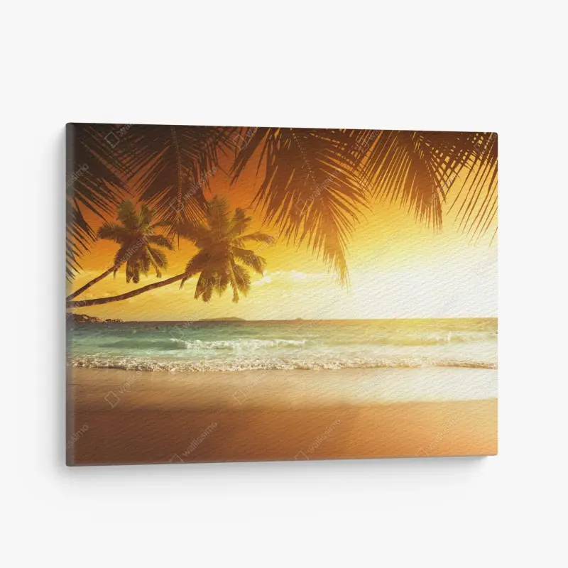Leinwandbild goldener sonnenuntergang an einem strand in der Karibik