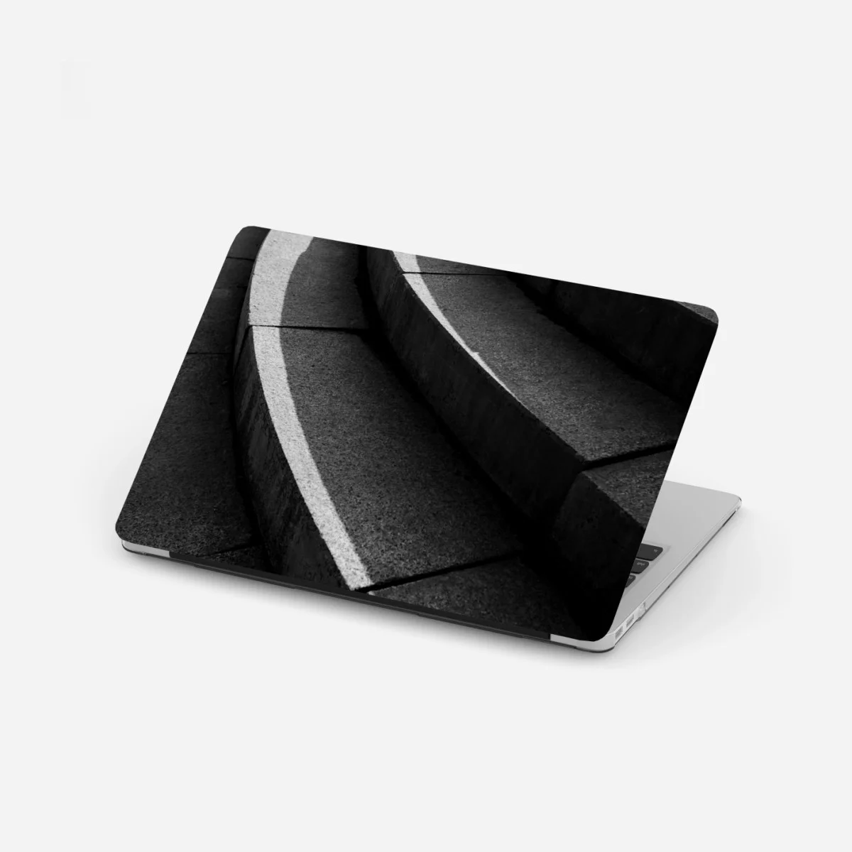 Laptop-Aufkleber geschwungene betontreppe im schatten – Wallnifity® Laptop-Aufkleber geschwungene betontreppe im schatten – Wallnifity®