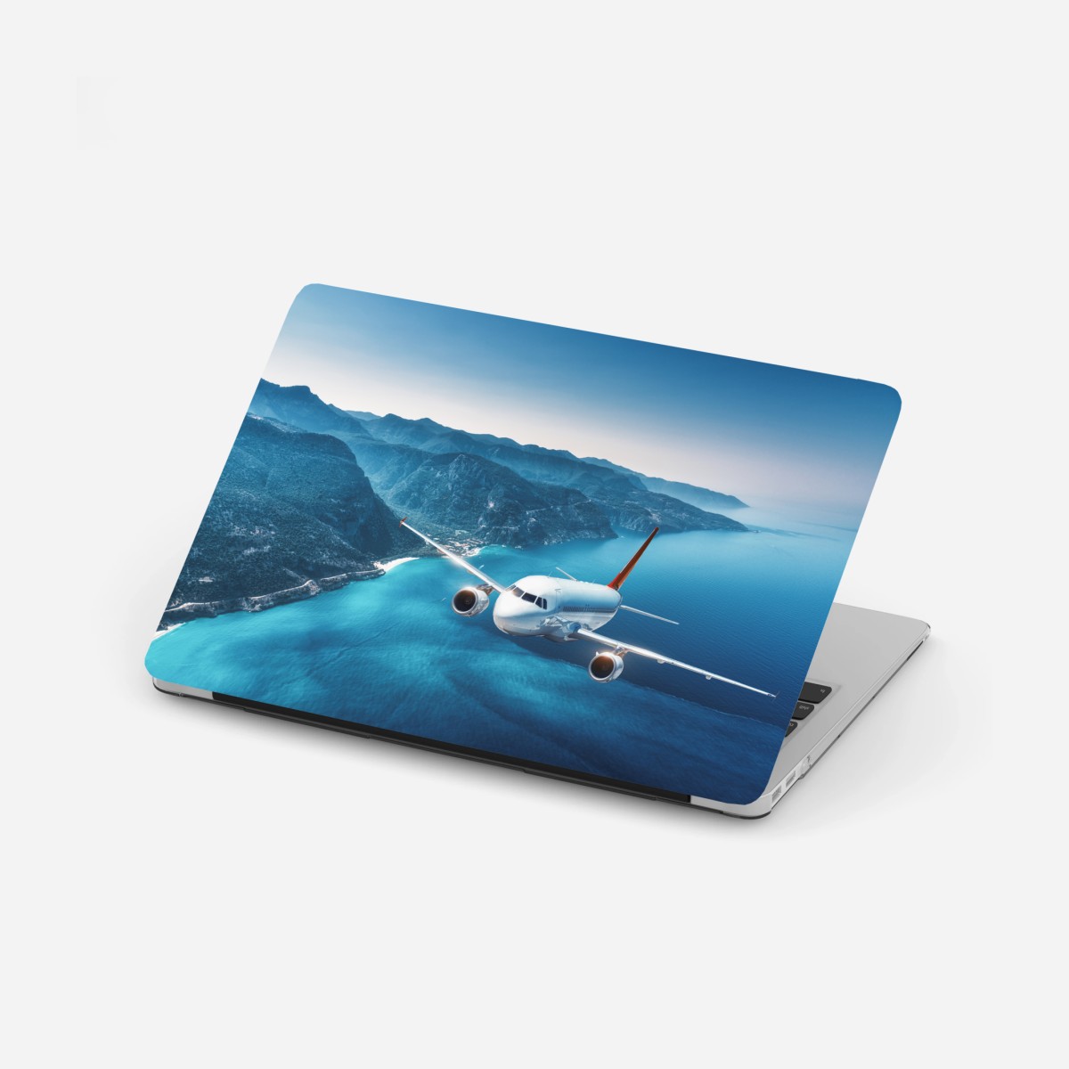 Laptop-Aufkleber küstenflug über türkisblauem meer – Wallnifity®