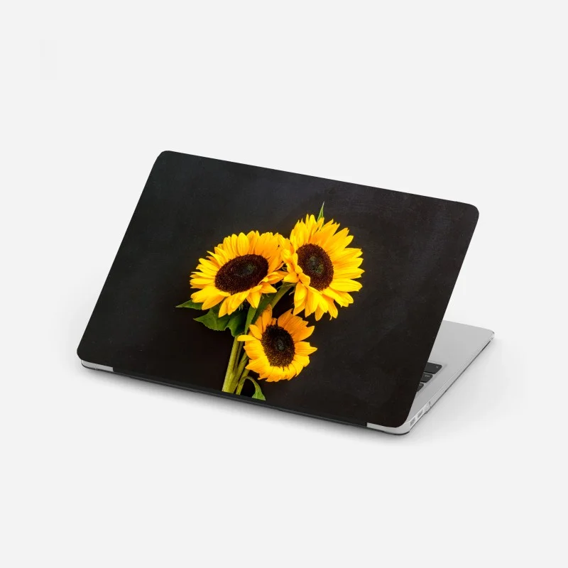 Laptop-Aufkleber leuchtende sonnenblumen auf schwarzem hintergrund
