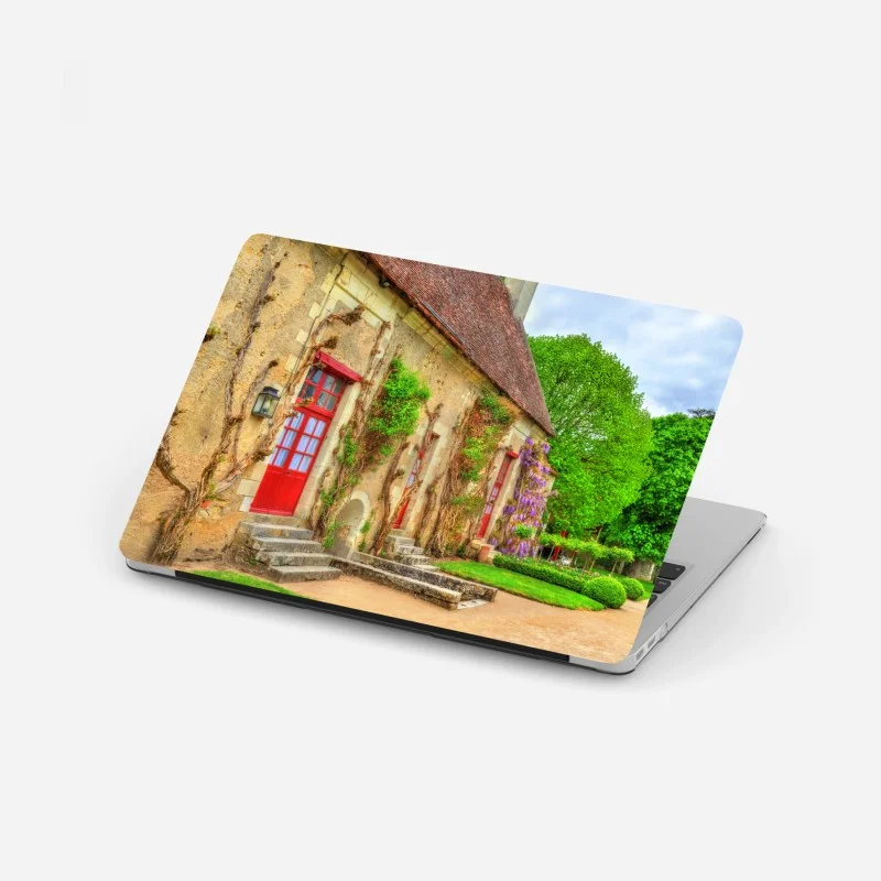 Laptop-Aufkleber reizendes landhaus mit blühender glyzinie